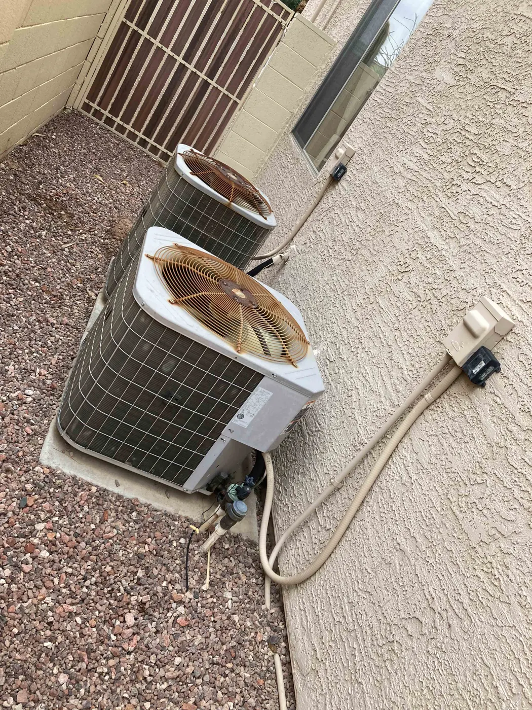 Older outdoor condenser unit before replacement